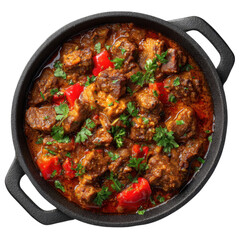 Delicious homemade beef goulash stew with red peppers and fresh parsley garnished in a cast iron pot
