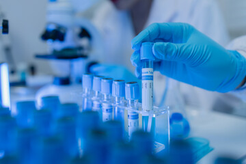 two scientists are working together to find a new antiviral drug, two chemists are using scientific...