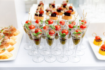 Festive buffet. Table with desserts in glass and snacks. Catering. Buffet. Self-service. Hotel and restaurant services. Wedding buffet