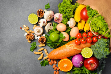 Delivery healthy food background. Healthy vegan vegetarian food in paper bag vegetables and fruits...