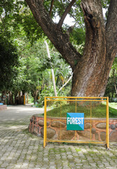 A Forest signboard on a barricade inside a jungle safari in Karnataka, India.