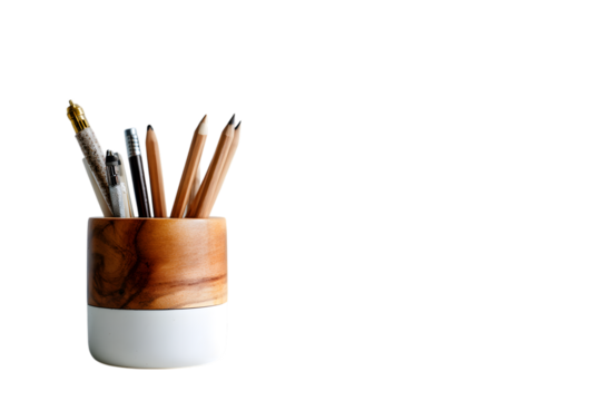 Wooden desk organizer filled with writing utensils isolated on a white background studio shot