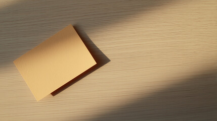A blank notecard on light wood, embodying simplicity and natural beauty.