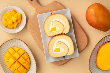 Delicious mango cream Swiss roll cake on plate