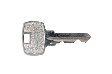 Silver metal key isolated on white background, close-up view.