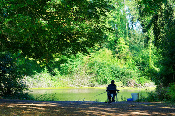 Fisherman at the Cat pond in the marshes of the lower valleys of the Juine and the Essonne river. Vert-le- Petit village village