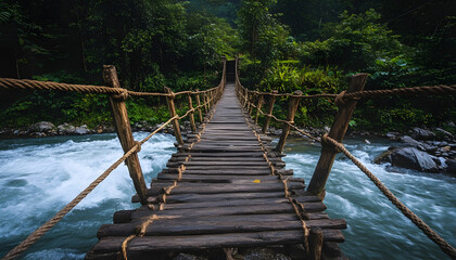 Fototapeta premium Scenic wooden bridge with rope railings over calm water leading to a distant shoreline