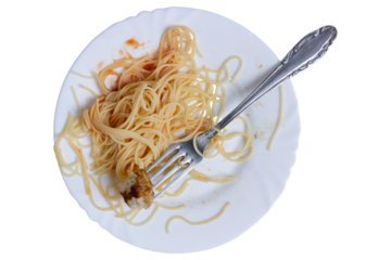 Half-eaten spaghetti on a plate with fork on a white background.