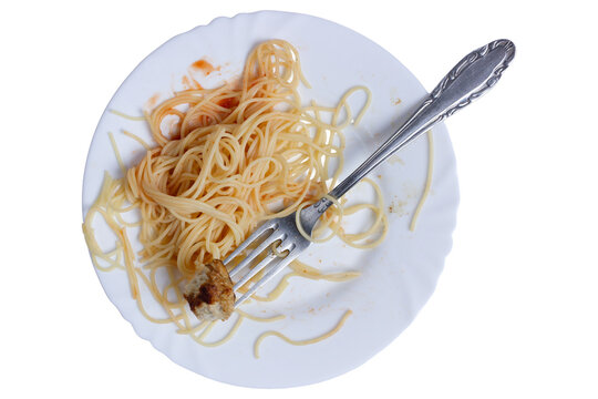 Half-eaten spaghetti on a plate with fork on a white background. - Powered by Adobe