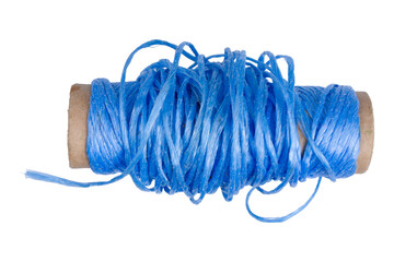 Blue twine wrapped around a cardboard spool on white background.