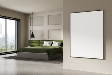 Framed blank poster mockup on wall in stylish bedroom interior with green bed and city view through...