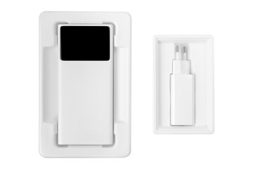 Portable white power bank and charger in packaging.