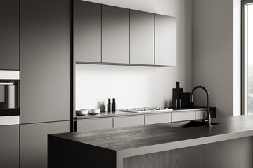 Modern minimalist kitchen interior concept with sleek cabinetry, wood countertop island, and built-in appliances in neutral tones on daylight background. 3D Rendering