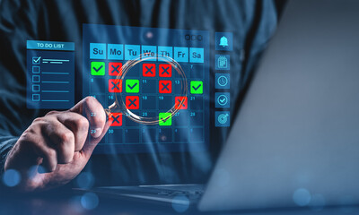 Businessman using digital calendar interface with checkmarks and cross marks for scheduling and...