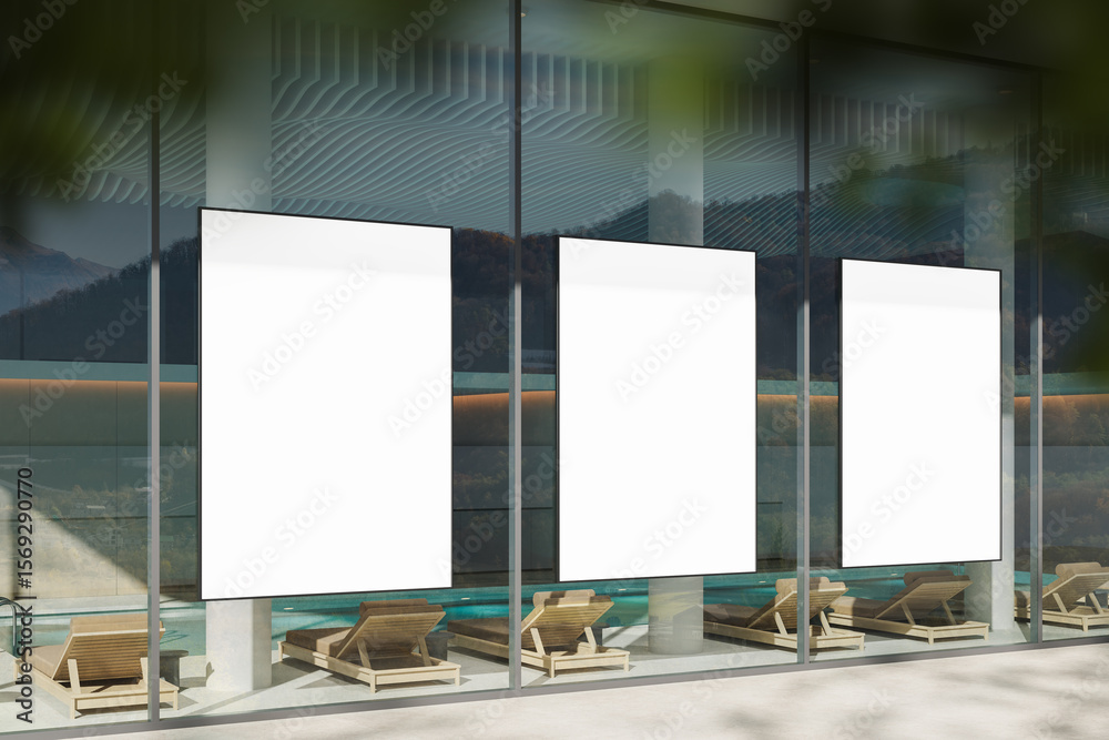 Fototapete three vertical blank poster mockups displayed on glass wall of modern building with minimalist pools