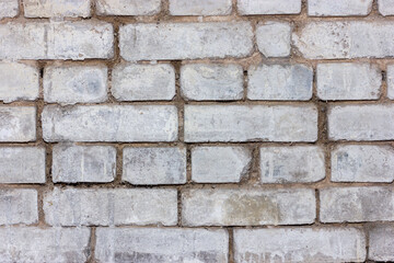Gray brick wall texture with vintage and rustic appeal.