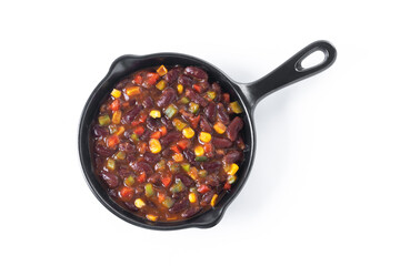 Mexican chilli beans with vegetables in iron pan isolated on white background. Top view