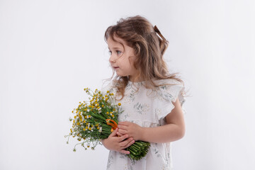 Cute little girl with bouquet of beautiful chamomile flowers on white background