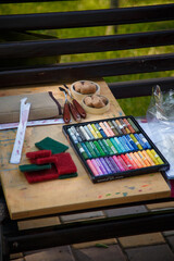Box of soft pastels, sponges and palette knives. Art tools for drawing and painting