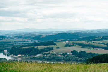 Stunning panorama of Lower Austria's rolling hills and lush greenery on a cloudy day