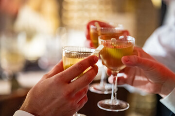 Toasting Cocktails in a Warm Elegant Evening Atmosphere