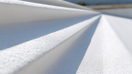Close-up view of white tpo roof with smooth surface and angled lines.