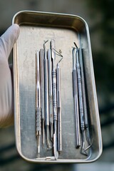 Close-up of dental tools used by dentistry students or interns during clinical practice. Includes...