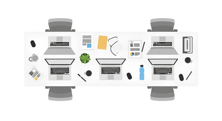 Clean workspace setup featuring multiple laptops, office supplies and a small green plant, perfect for illustrating workplace concepts.