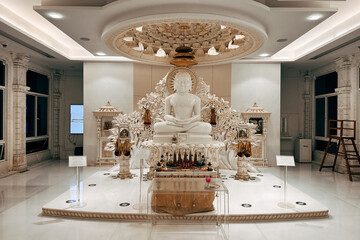 White marble Jain Tirthankara statues and spiritual saint idol in a modern Jain temple museum...