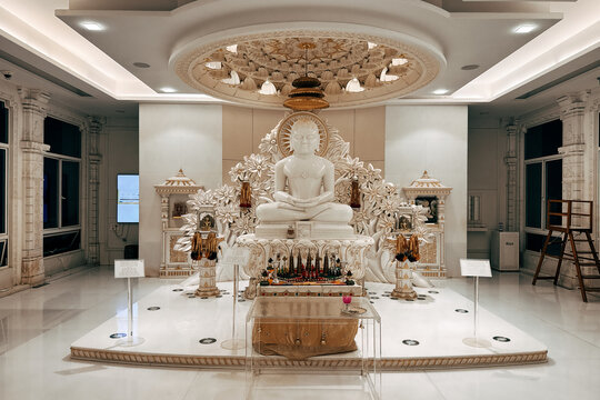 White marble Jain Tirthankara statues and spiritual saint idol in a modern Jain temple museum setting, symbolizing peace, non-violence, and meditation in Indian spiritual culture.