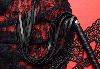 Leather Black Whip For Sex Games On Black Lace Lingerie. BDSM Toys For Role Play Sex Games.