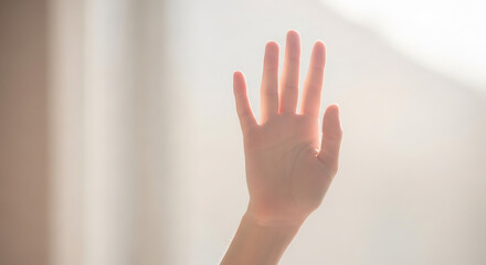 Hand Reaching Up, Palm Open in Bright Light, Stop or Greeting Gesture