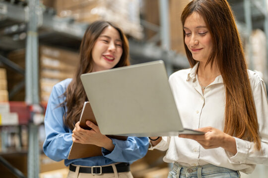 Asian warehouse staff teamwork, supply chain logistics management, shipping inventory check with laptop and clipboard, modern e-commerce b2b fulfillment, smart warehouse system wms operation, industry