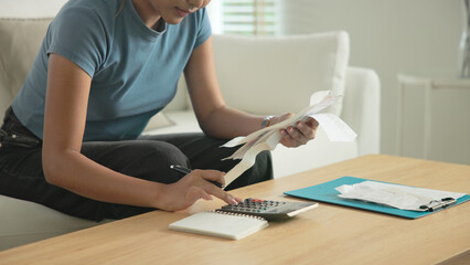 Cost of living income expense saving budget in black asia people Gen Z young adult woman. Looking...