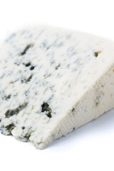 Piece of Blue Cheese isolated on white background. Close up