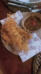 Filipino and Middle Eastern fusion cuisine featuring deep-fried mozzarella covered in shredded lumpia wrapper, served with a side of dukkha and mango chutney
