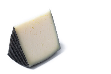 Close-up of a wedge of semi-cured cow's cheese isolated on white background. Copy space	