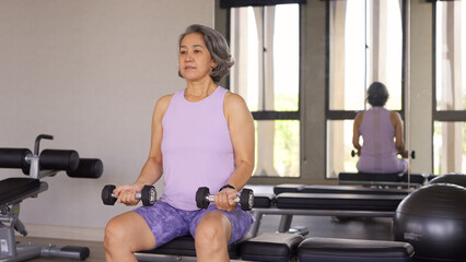 Asia adult aged people middle age happy old woman gym workout body weight arm picking up lift...