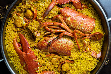 Spanish seafood paella with lobster, prawns and Mediterranean rice
