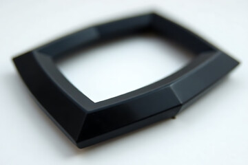 Black plastic frame with beveled edges on a white background.
