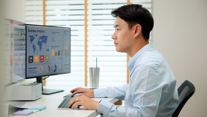 Asia people expert man tech talent working on project predict sales insight SEO graph chart AI smart plan visual big data science report center BI smart tools screen. Office worker asian analyst job.