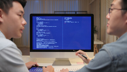 Smart AI cyber bot deep tech tools help write prompt code screen. Asia people asian man IT team typing busy talking work on predict big data center office reskill upskill STEM expert skill job course.