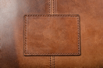Stitched brown leather square patch