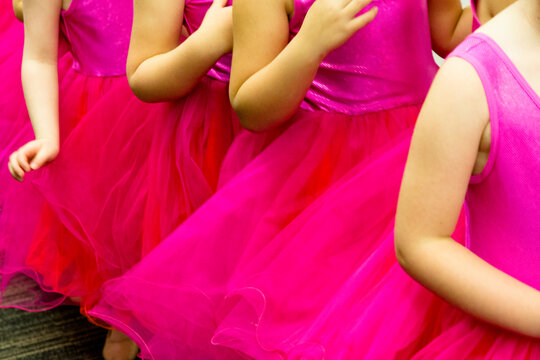 Young girls dressed in pink to perform at a ballet concert