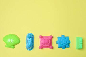 Children's toys on a yellow background