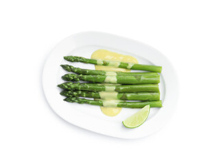 Tasty cooked asparagus with sauce and lime isolated on white, top view