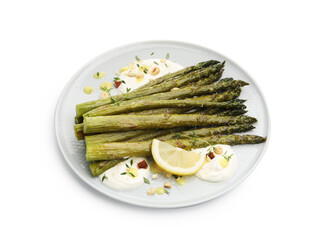 Tasty cooked asparagus with lemon and sauce isolated on white