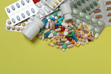 Tablets scattered on a yellow background