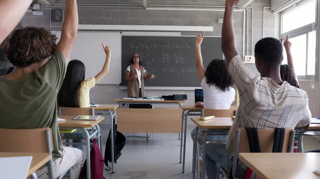 Students raising hands in physics class montage