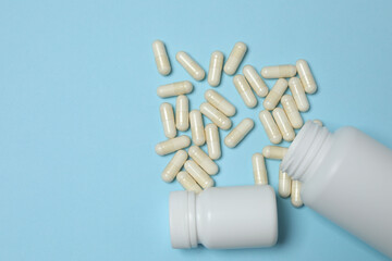 loose tablets on a blue background